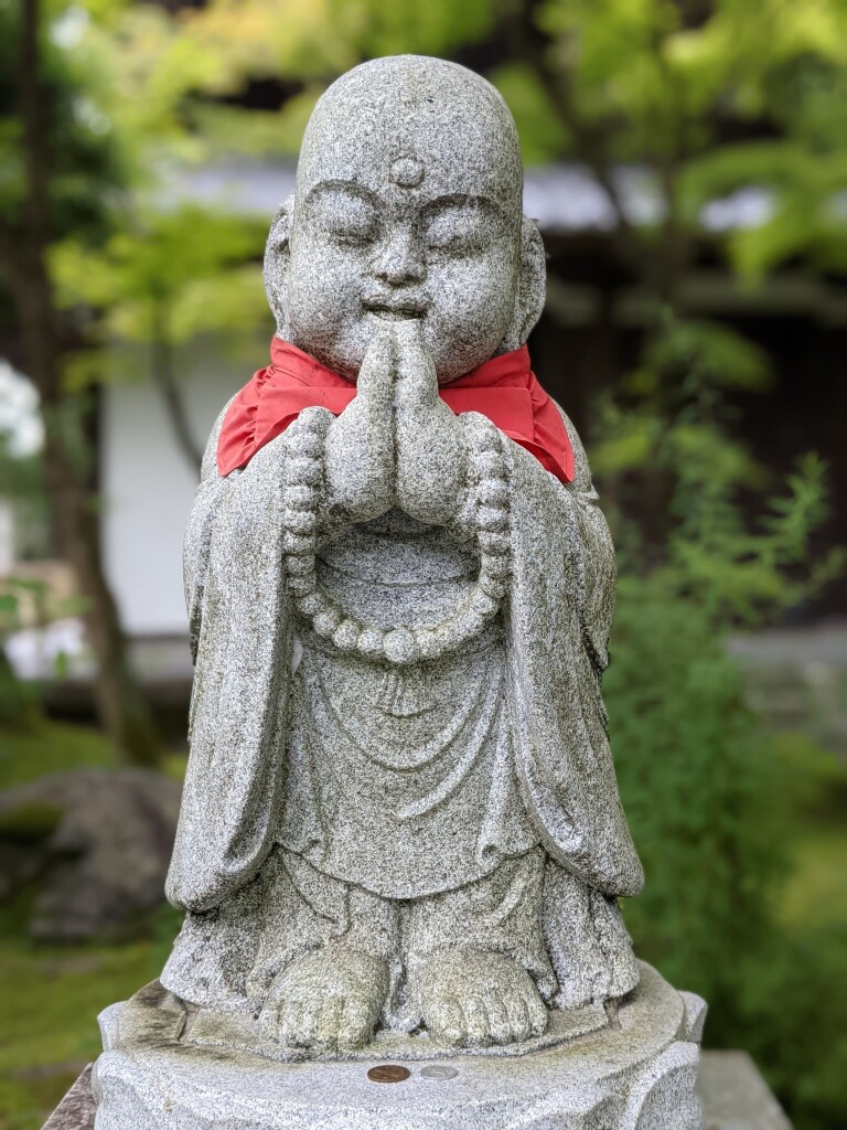 One of the temple's many statues of Jizo.