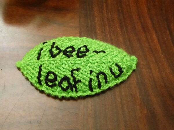 the leaf says "i bee-leaf in u"