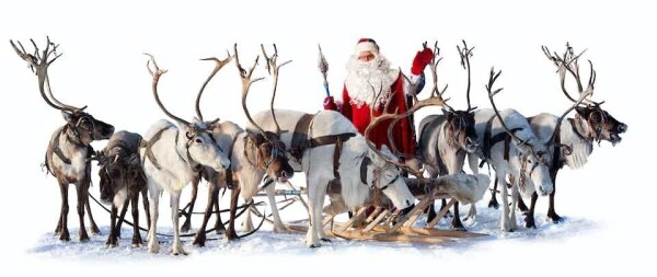 Santa waves behind a line of reindeer.
Vladimir Melnikov/Shutterstock